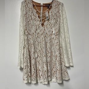 Forever 21 white lace up mini dress. Size M. Color: white with beige lining.